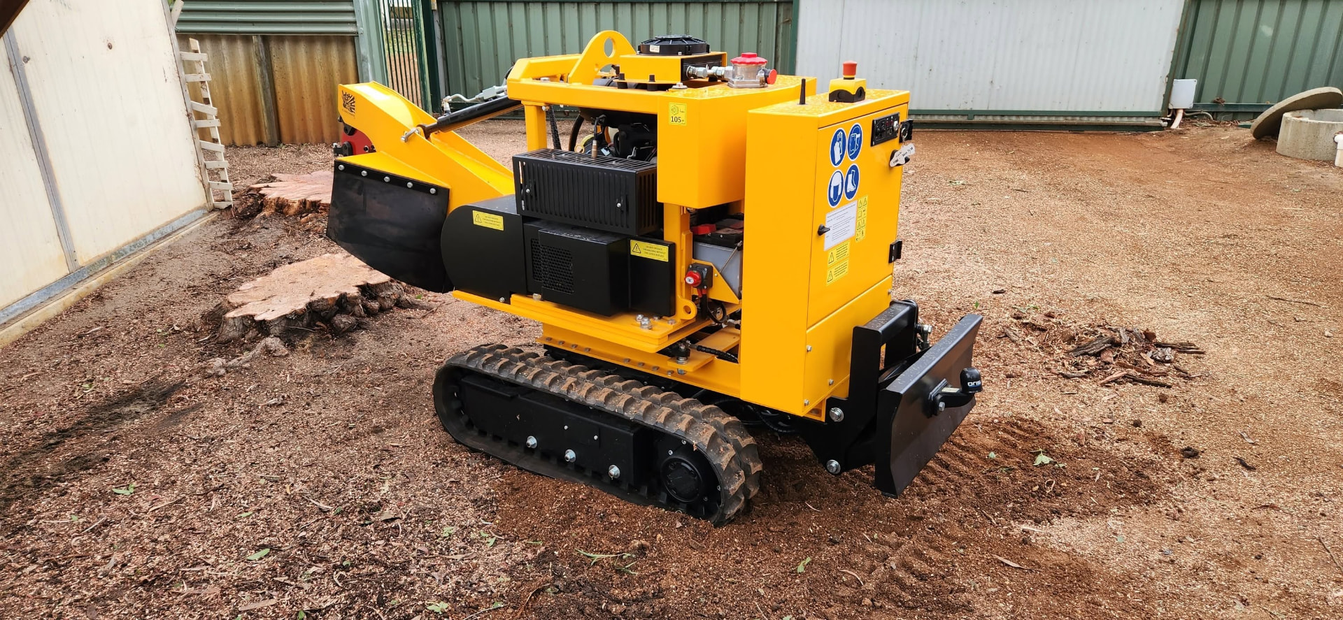 Close-up of the Savvy tracked stump grinding machine